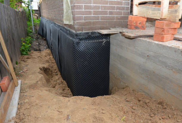 Happy homeowners after waterproofing job in Republic